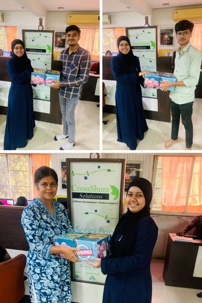 CrossShore Infotech employees receiving mango boxes during the mango season celebration, showcasing appreciation and summer joy.